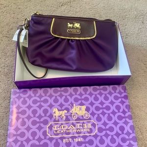NWT purple satin Coach clutch.